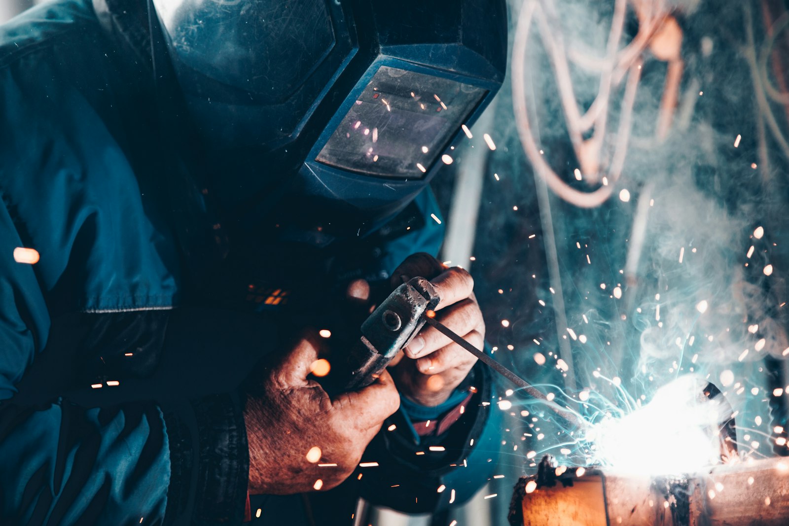 Industrial welding of metal in a production environment